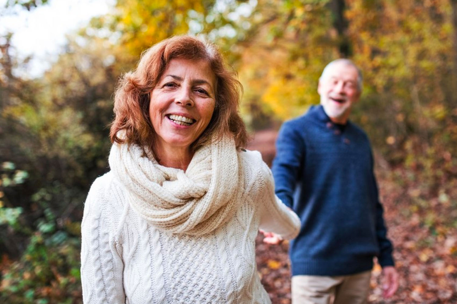 Behavioral Health photo with couple walking in woods