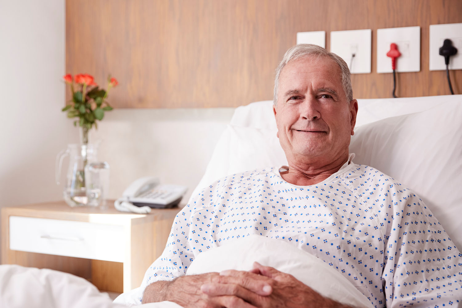 Hospital Services photo with man in hospital bed