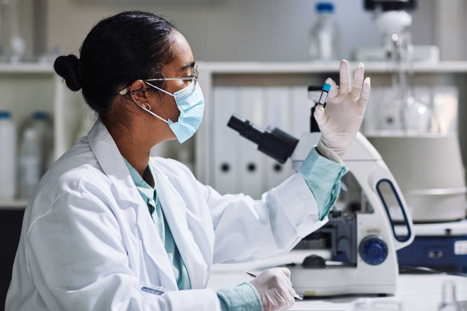 Laboratory services photo with pathologist examining blood